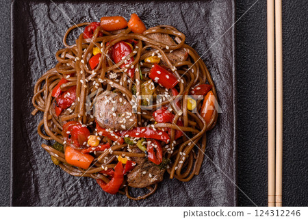 Delicious spicy Asian food soba with buckwheat noodles, beef, vegetables Delicious spicy Asian food soba with buckwheat noodles, beef, vegetables 124312246