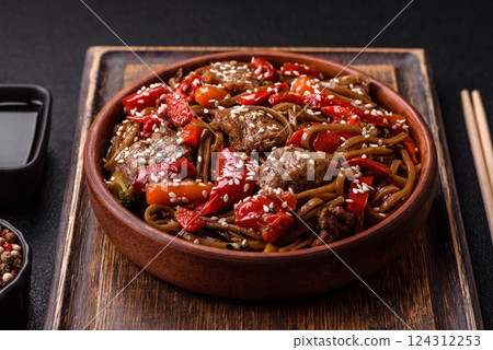 Delicious spicy Asian food soba with buckwheat noodles, beef, vegetables 124312253