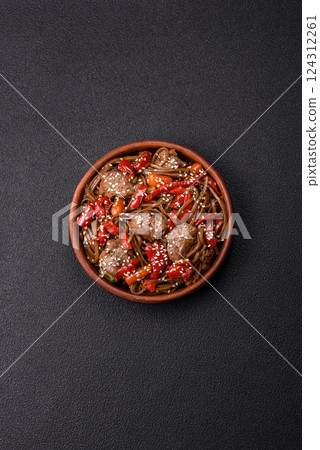 Delicious spicy Asian food soba with buckwheat noodles, beef, vegetables 124312261