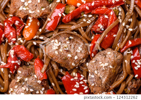 Delicious spicy Asian food soba with buckwheat noodles, beef, vegetables Delicious spicy Asian food soba with buckwheat noodles, beef, vegetables 124312262