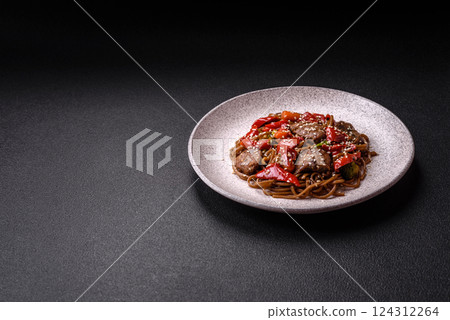 Delicious spicy Asian food soba with buckwheat noodles, beef, vegetables 124312264