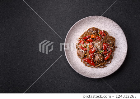 Delicious spicy Asian food soba with buckwheat noodles, beef, vegetables Delicious spicy Asian food soba with buckwheat noodles, beef, vegetables 124312265