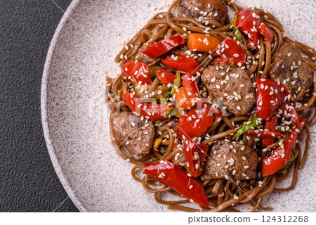 Delicious spicy Asian food soba with buckwheat noodles, beef, vegetables Delicious spicy Asian food soba with buckwheat noodles, beef, vegetables 124312268