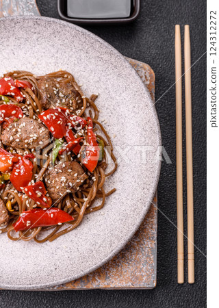 Delicious spicy Asian food soba with buckwheat noodles, beef, vegetables Delicious spicy Asian food soba with buckwheat noodles, beef, vegetables 124312272
