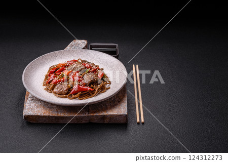 Delicious spicy Asian food soba with buckwheat noodles, beef, vegetables Delicious spicy Asian food soba with buckwheat noodles, beef, vegetables 124312273