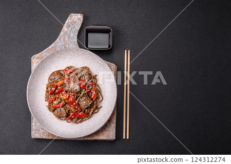 Delicious spicy Asian food soba with buckwheat noodles, beef, vegetables Delicious spicy Asian food soba with buckwheat noodles, beef, vegetables 124312274