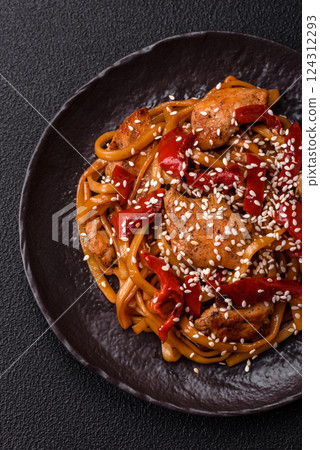 Delicious Asian food udon with noodles, chicken, hot pepper, vegetables Delicious Asian food udon with noodles, chicken, hot pepper, vegetables 124312293