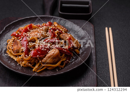 Delicious Asian food udon with noodles, chicken, hot pepper, vegetables Delicious Asian food udon with noodles, chicken, hot pepper, vegetables 124312294