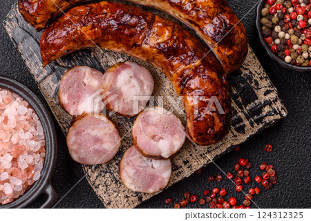 Delicious sausage with salt, spices and herbs Delicious sausage with salt, spices and herbs 124312325