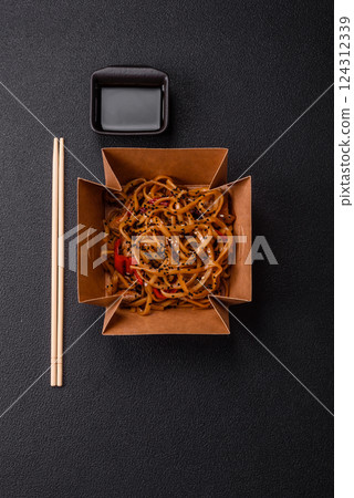 Delicious Asian food udon with noodles, chicken, hot pepper, vegetables 124312339