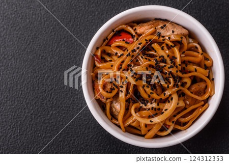 Delicious Asian food udon with noodles, chicken, hot pepper, vegetables Delicious Asian food udon with noodles, chicken, hot pepper, vegetables 124312353
