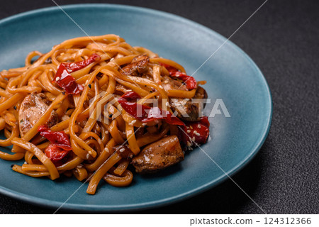 Delicious Asian food udon with noodles, chicken, hot pepper, vegetables 124312366