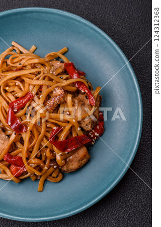 Delicious Asian food udon with noodles, chicken, hot pepper, vegetables 124312368