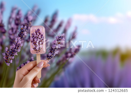 Lavender ice cream in woman's hand against blurred floral background of blooming lavender, combining nature with sophistication gastronomic journey, summer cooling sweets and organic ice cream concept Lavender ice cream in woman's hand against blurred floral background of blooming lavender, combining nature with sophistication gastronomic journey, summer cooling sweets and organic ice cream concept 124312685