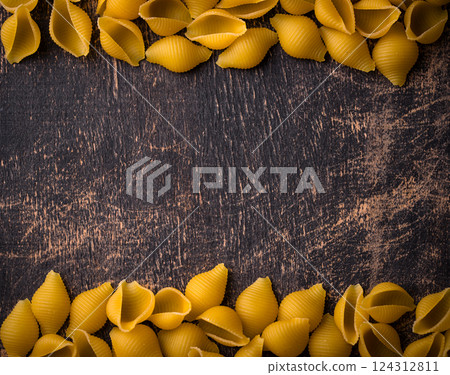 Raw pasta in shape of shells 124312811