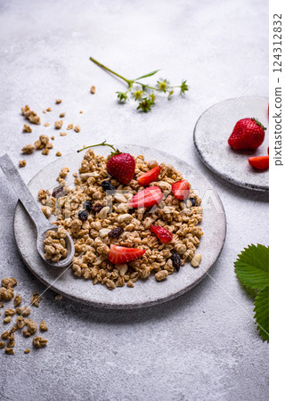 Homemade granola with fresh strawberry Homemade granola with fresh strawberry 124312832