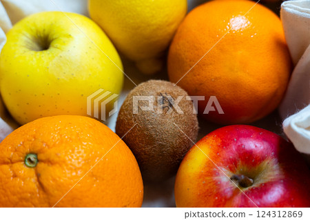 A Colorful and Vibrant Assortment of Fresh Fruits Arranged on a Cloth Background A Colorful and Vibrant Assortment of Fresh Fruits Arranged on a Cloth Background 124312869