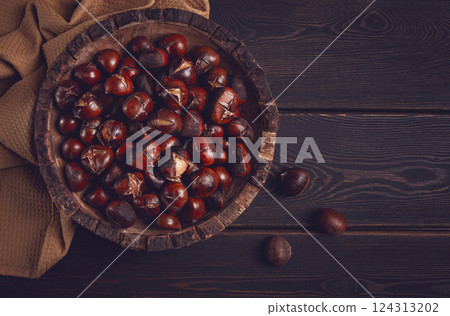 roasted chestnuts, in a wooden plate, top view, homemade, no people, 124313202
