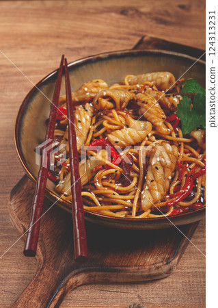 udon noodles, with squid and vegetables, on a wooden table, homemade, no people, 124313231