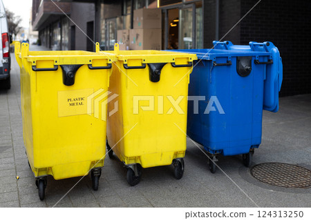 Yellow and blue Recycling Bin for plastic Waste. Waste containers for garbage segregation in Poland. Environmental conservation saving planet from contamination Yellow and blue Recycling Bin for plastic Waste. Waste containers for garbage segregation in Poland. Environmental conservation saving planet from contamination 124313250