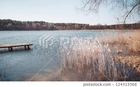 Landscape with a lake on a sunny day, color toning applied. Landscape with a lake on a sunny day, color toning applied. 124313568