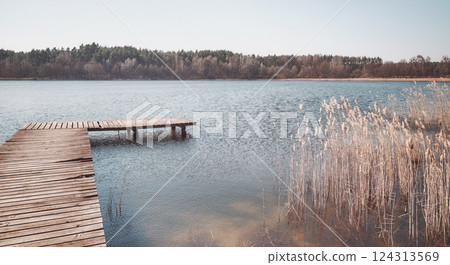 Landscape with a lake on a sunny day, color toning applied. Landscape with a lake on a sunny day, color toning applied. 124313569