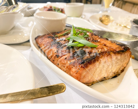 tuna steak on a table in a restaurant tuna steak on a table in a restaurant 124313842