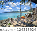 Tropical Paradise Shoreline with Ocean View Swing on Wooden Deck in Phuket, Thailand 124313924