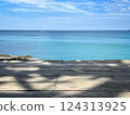 An Empty Wooden Deck with A Serene Ocean View Background 124313925