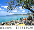 Tropical Paradise Shoreline with Ocean View Swing on Wooden Deck in Phuket, Thailand 124313926