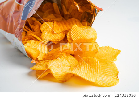 Potato chips delicious BBQ seasoning spicy for crips, thin slice deep fried snack fast food. 124318036