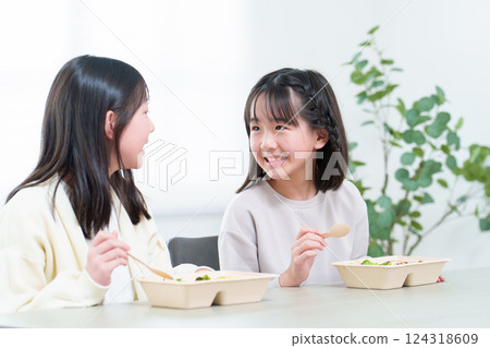 A girl who eats rice A girl who eats rice 124318609