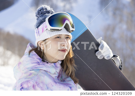 Cute woman in ski wear 124320109
