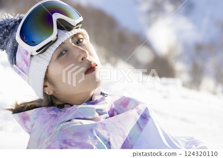 Cute woman in ski wear 124320110