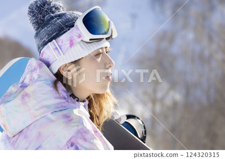 Cute woman in ski wear Cute woman in ski wear 124320315