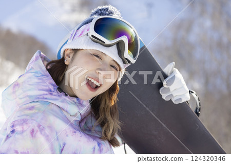 Cute woman in ski wear 124320346