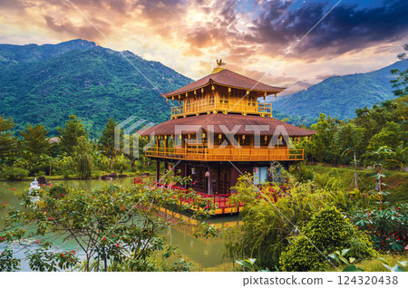 Asian Buddhist Temple on water on the pond at Vietnamese Nghia Son Pagoda in Vietnam in Nha Trang in Asia at sunrise Asian Buddhist Temple on water on the pond at Vietnamese Nghia Son Pagoda in Vietnam in Nha Trang in Asia at sunrise 124320438