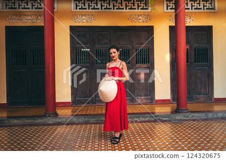 beautiful young tourist woman in Non La hat at Long Son Pagoda in Vietnam in Asia 124320675