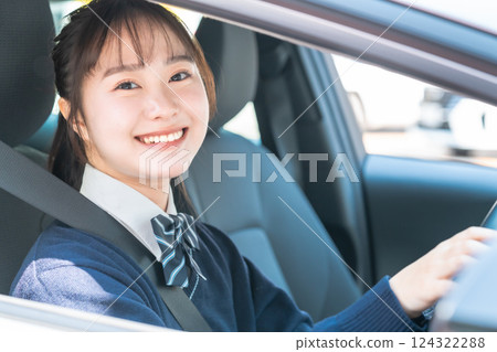 High school students getting a regular driver's license at a driving school High school students getting a regular driver's license at a driving school 124322288