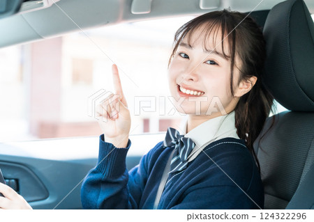 High school students getting a regular driver's license at a driving school High school students getting a regular driver's license at a driving school 124322296