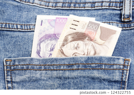 Czech koruna in the pocket of blue jeans 124322755