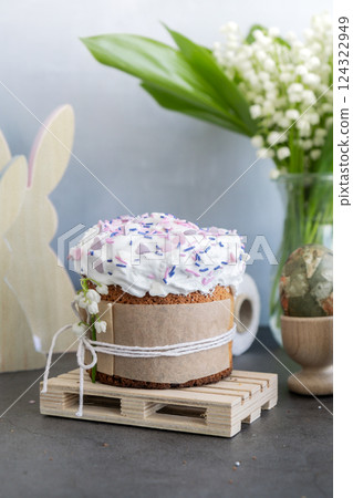Homemade traditional Easter cake pastry bakery. Festive spring table setting decoration with fresh flowers eggs. Easter family dinner or breakfast idea 124322949