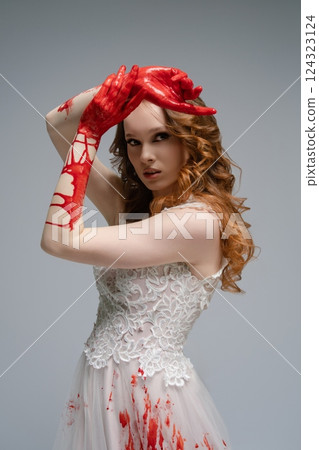 Bridal beauty with a katana amidst a dramatic display of blood Bridal beauty with a katana amidst a dramatic display of blood 124323124