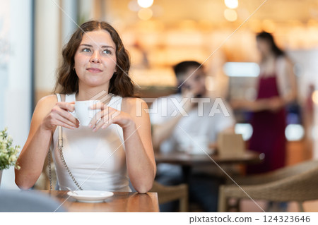 Woman enjoying a cup of coffee in the afternoon 124323646