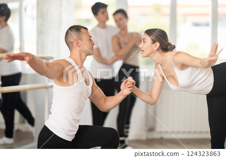 Young man and young woman rehearsing pair ballet 124323863
