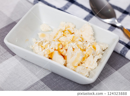Portion of traditional Catalan dessert, mato with honey 124323888