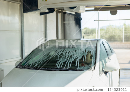Process of car washing with driver inside Process of car washing with driver inside 124323911