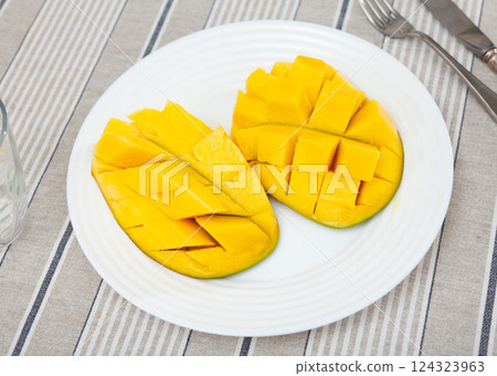 Deliciously served fresh mangoes diced and laid out on plate Deliciously served fresh mangoes diced and laid out on plate 124323963