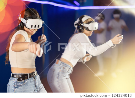 Girls play video games after guys 124324013