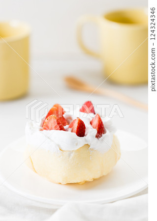 Crepe cake topped with fresh cream and strawberries. 124324346